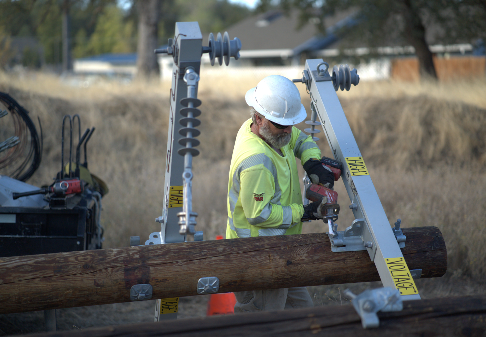 Linemen installing poles