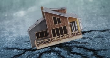 Image depicting a home falling as a result of an earthquake