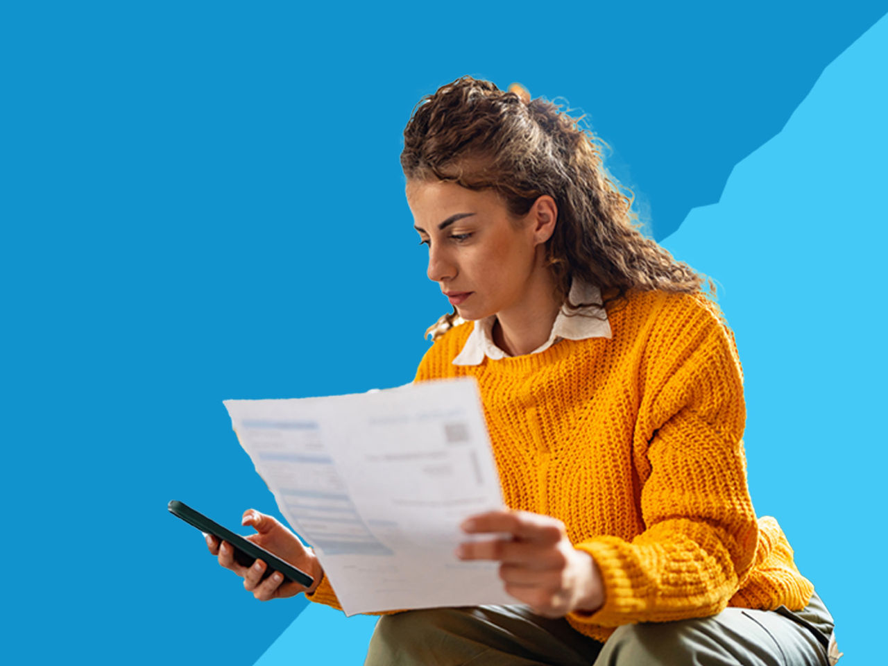 A woman looking at her PG&E bill