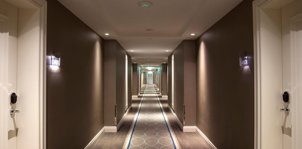 Long corridor. Indoor hotel hallway. 