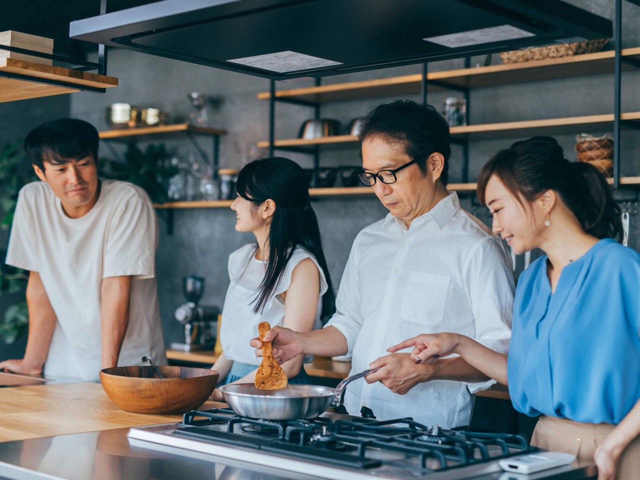 Family cooking with a gas stove