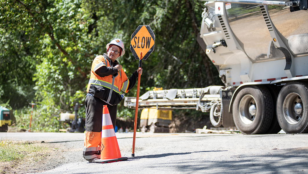 PG&E crew member directing traffic.